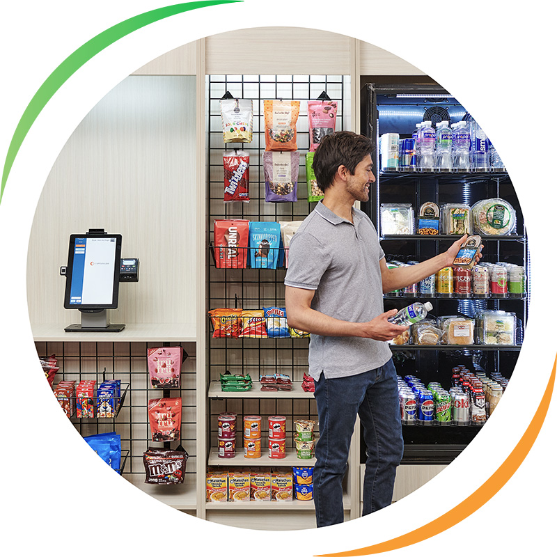 Man buying a drink from a cashless vending machine