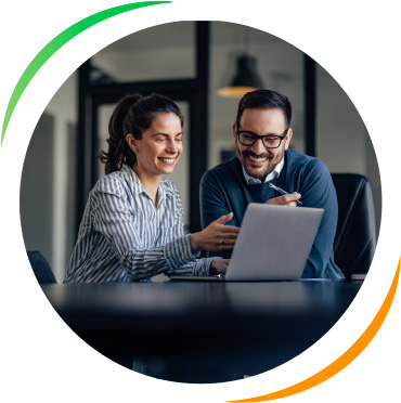 retail-main Two people looking at a laptop and smiling